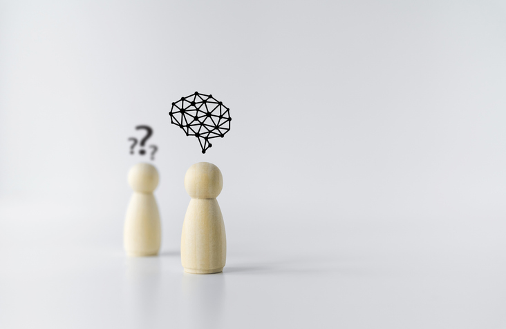 Wooden doll with brain icon. Businessperson or student or leader training skill improvement or development. Business knowledge and education learning success idea. Concept of leadership vision.